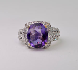 14K white gold ring with one center oval Amethyst and 62 side Diamonds