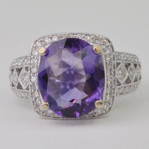 14K white gold ring with one center oval Amethyst and 62 side Diamonds