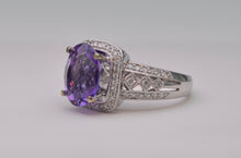 14K white gold ring with one center oval Amethyst and 62 side Diamonds