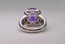 14K white gold ring with one center oval Amethyst and 62 side Diamonds