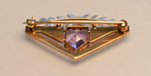 14K yellow gold brooch with white gold floral trim on top and Amethyst, with white enamel trims