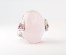 14K white gold ring with one large Rose Quartz cabochon framed with diamonds and pink Sapphires