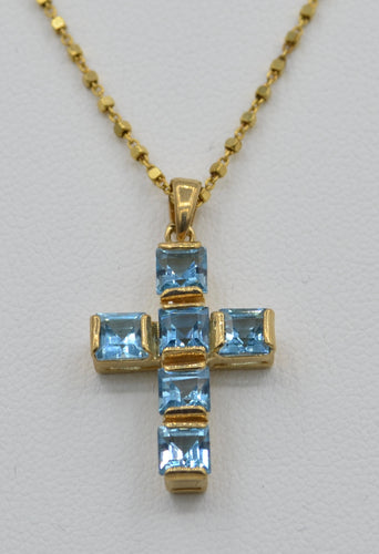 14K yellow gold cross set with square Blue Topaz