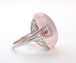 14K white gold ring with one large Rose Quartz cabochon framed with diamonds and pink Sapphires