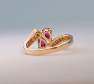 14K yellow gold ring with 2 pear-shaped Rubies and 8 side Diamonds