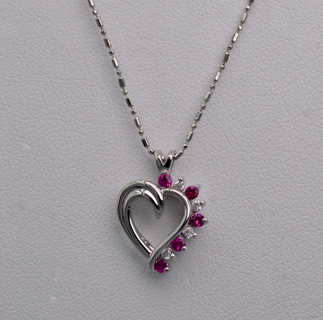 14K white gold heart-shaped pendant with Rubies and Diamonds