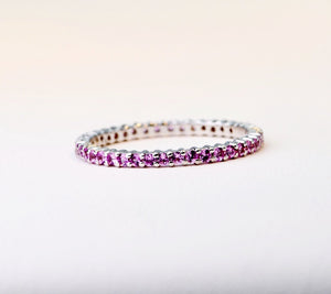 18K white gold band with 1.7mm Pink Sapphires all around