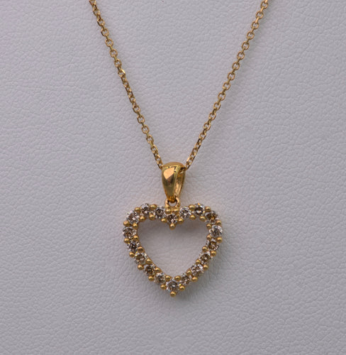 14K yellow gold heart-shaped pendant with diamonds