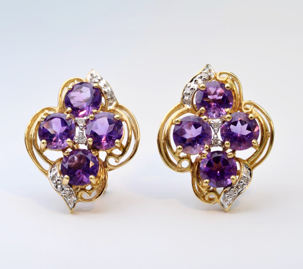 14K yellow gold earrings with four round Amethysts in each earring and diamond trims