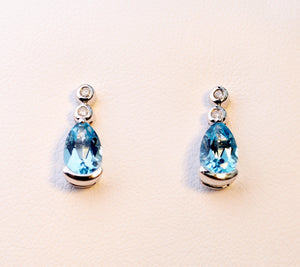 14K white gold post earrings with pear-shaped Blue Topaz drops